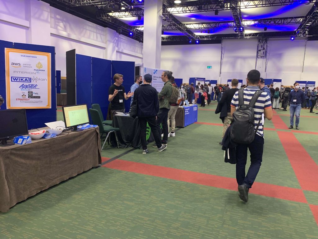 The exhibition hall of the conference with company booths and poster sessions.